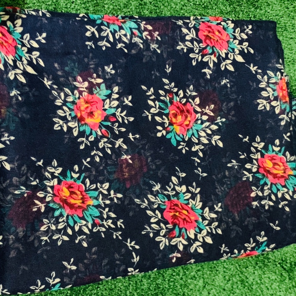Navy blue floral head/neck scarf.